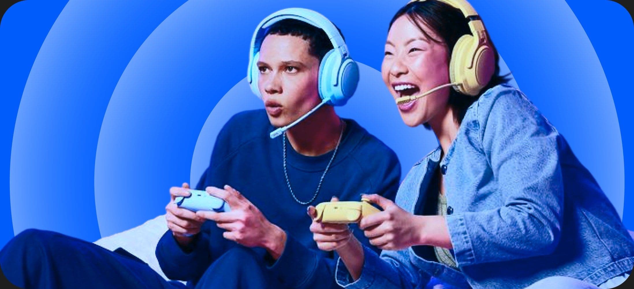 Two people wearing headsets playing a game with controllers